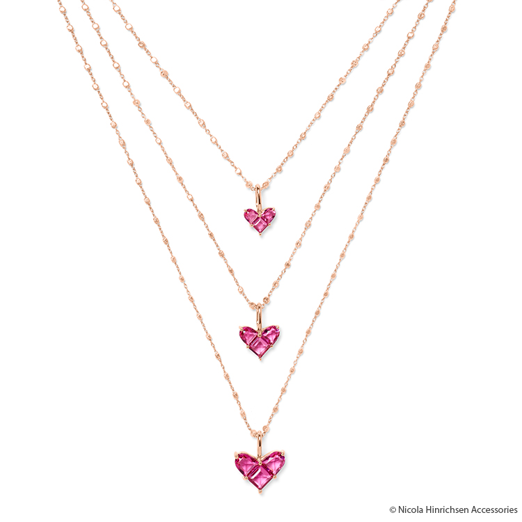 Three rose gold necklaces with pink heart pendant after straightening